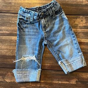 Distressed denim jeans